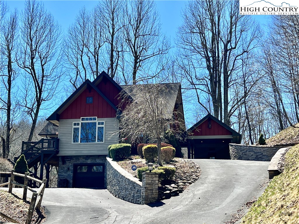 259 The Settlement Boone, NC 28607 - Photo 3 of 50 a front view of house with yard outdoor seating and barbeque oven