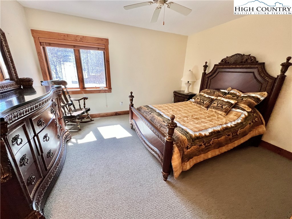 259 The Settlement Boone, NC 28607 - Photo 37 of 50 a bedroom with a bed and wooden floor