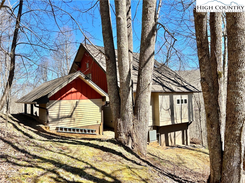 259 The Settlement Boone, NC 28607 - Photo 7 of 50 a view of a brick house with many windows