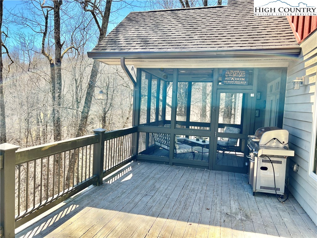 259 The Settlement Boone, NC 28607 - Photo 10 of 50 a view of a porch with furniture and wooden floor