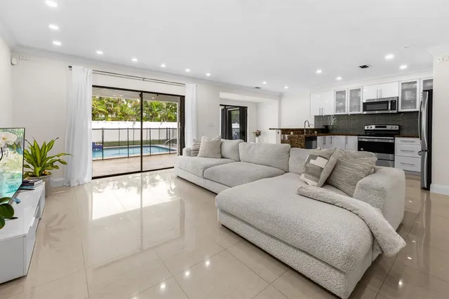 a large bedroom with a bed and glass floor