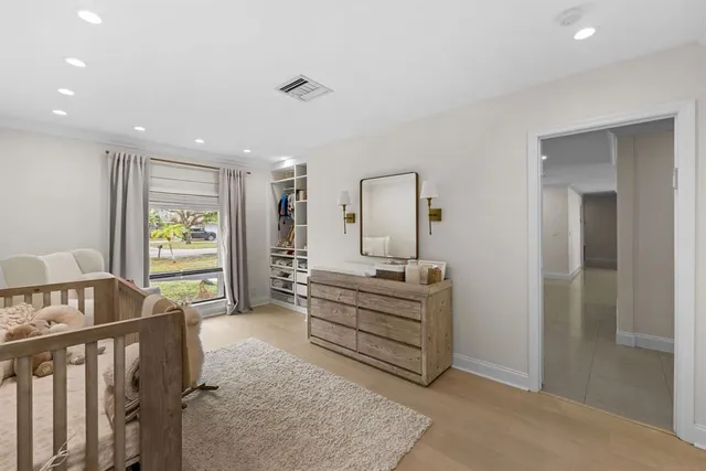 a room with a bed and a window