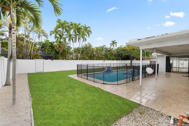 a view of backyard with a garden and plants