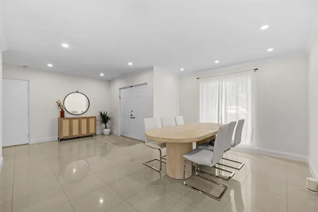 a view of a room with gym equipment and a window