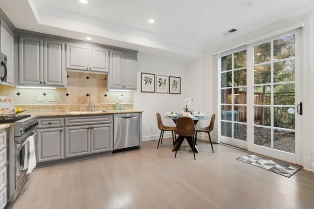 a kitchen with a sink cabinets and window