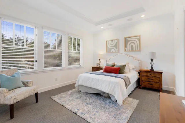 a bedroom with bed and a couch