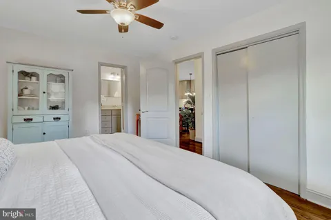 a bedroom with a large bed and closet