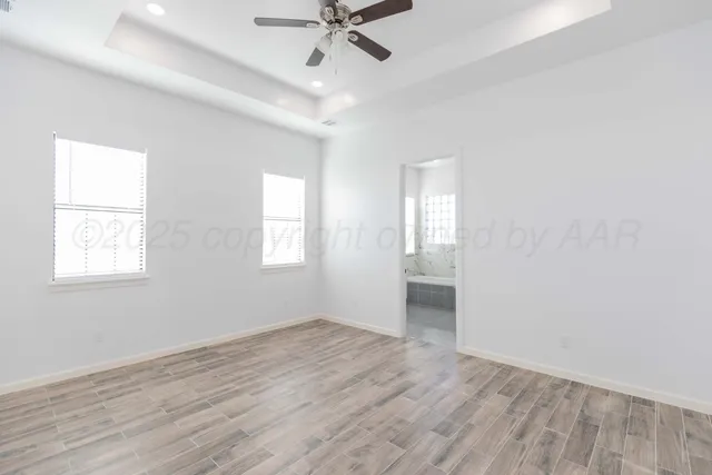 a bathroom with double vanity sink a mirror and a shower