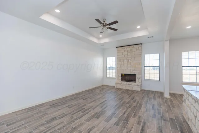 a view of a kitchen with a sink and wooden floor