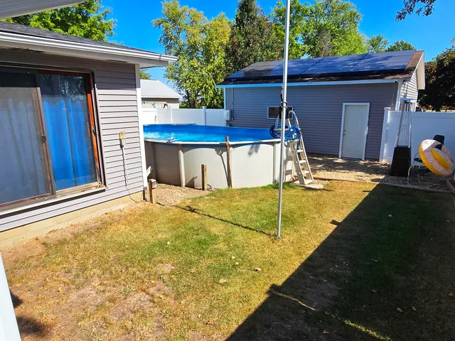 a view of pool table and chairs