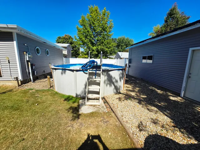 a view of a patio with table and chairs and potted plants