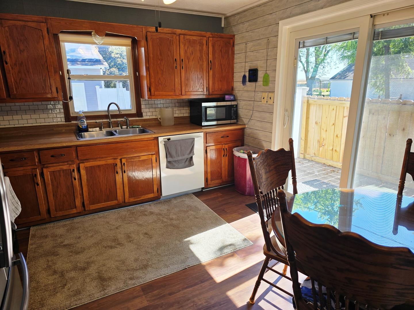 602 North 4th Avenue Chenoa, IL 61726 - Photo 7 of 38 a kitchen with stainless steel appliances granite countertop wooden cabinets a stove top oven a sink and dishwasher