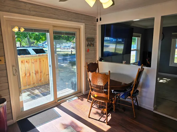 a living room with furniture and a floor to ceiling window