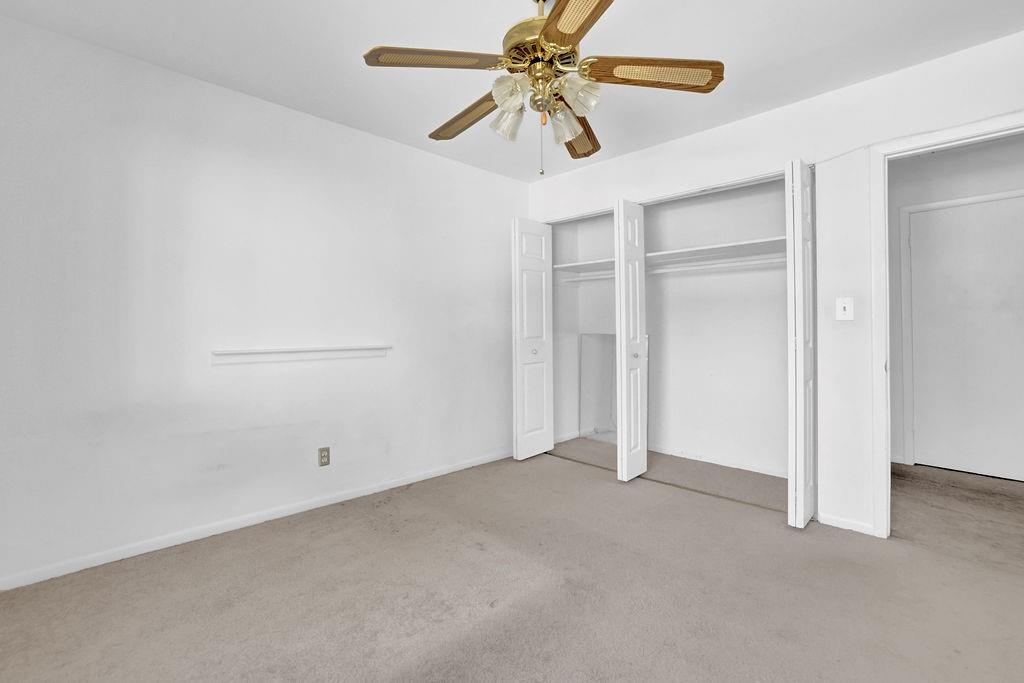 3312 Northcrest Road, Unit C Atlanta, GA 30340 - Photo 15 of 29 an empty room with windows and fan
