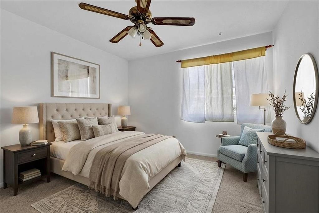 3312 Northcrest Road, Unit C Atlanta, GA 30340 - Photo 16 of 29 a bedroom with a bed a couch and a window