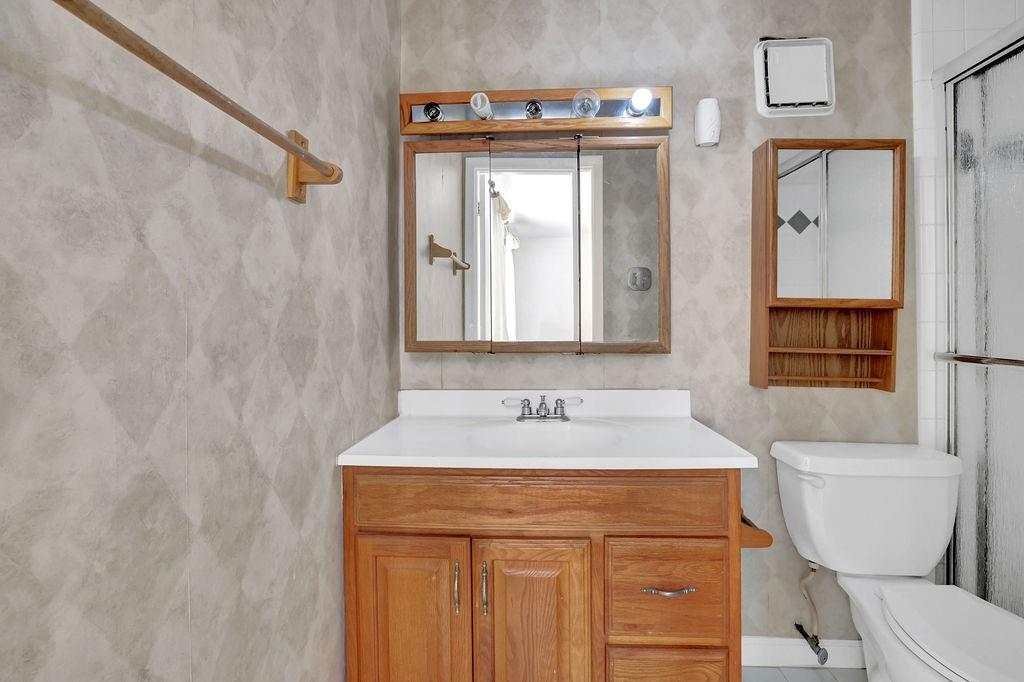 3312 Northcrest Road, Unit C Atlanta, GA 30340 - Photo 24 of 29 a bathroom with a sink and a toilet