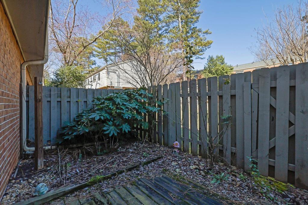 3312 Northcrest Road, Unit C Atlanta, GA 30340 - Photo 26 of 29 a view of a garden with wooden fence