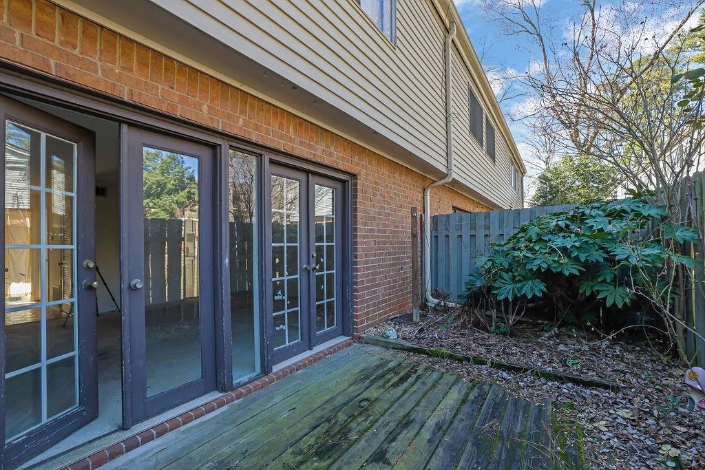 3312 Northcrest Road, Unit C Atlanta, GA 30340 - Photo 27 of 29 a view of backyard with potted plants and wooden fence