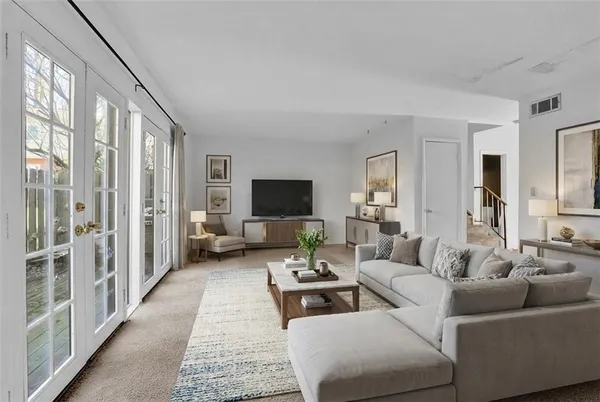 a living room with furniture or couch and a flat screen tv