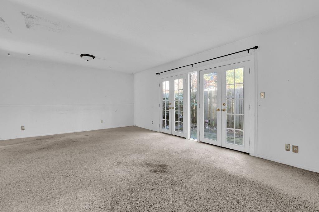 3312 Northcrest Road, Unit C Atlanta, GA 30340 - Photo 6 of 29 a view of an empty room with glass door and balcony