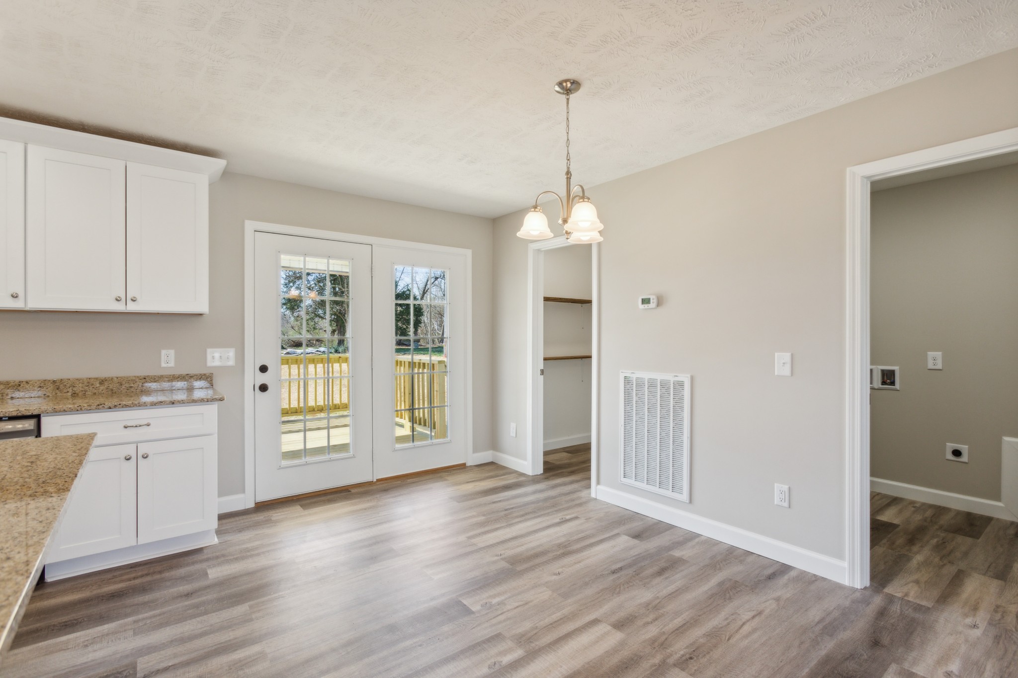 812 Days Road Lafayette, TN 37083 - Photo 11 of 25 a view of an empty room with window and wooden floor