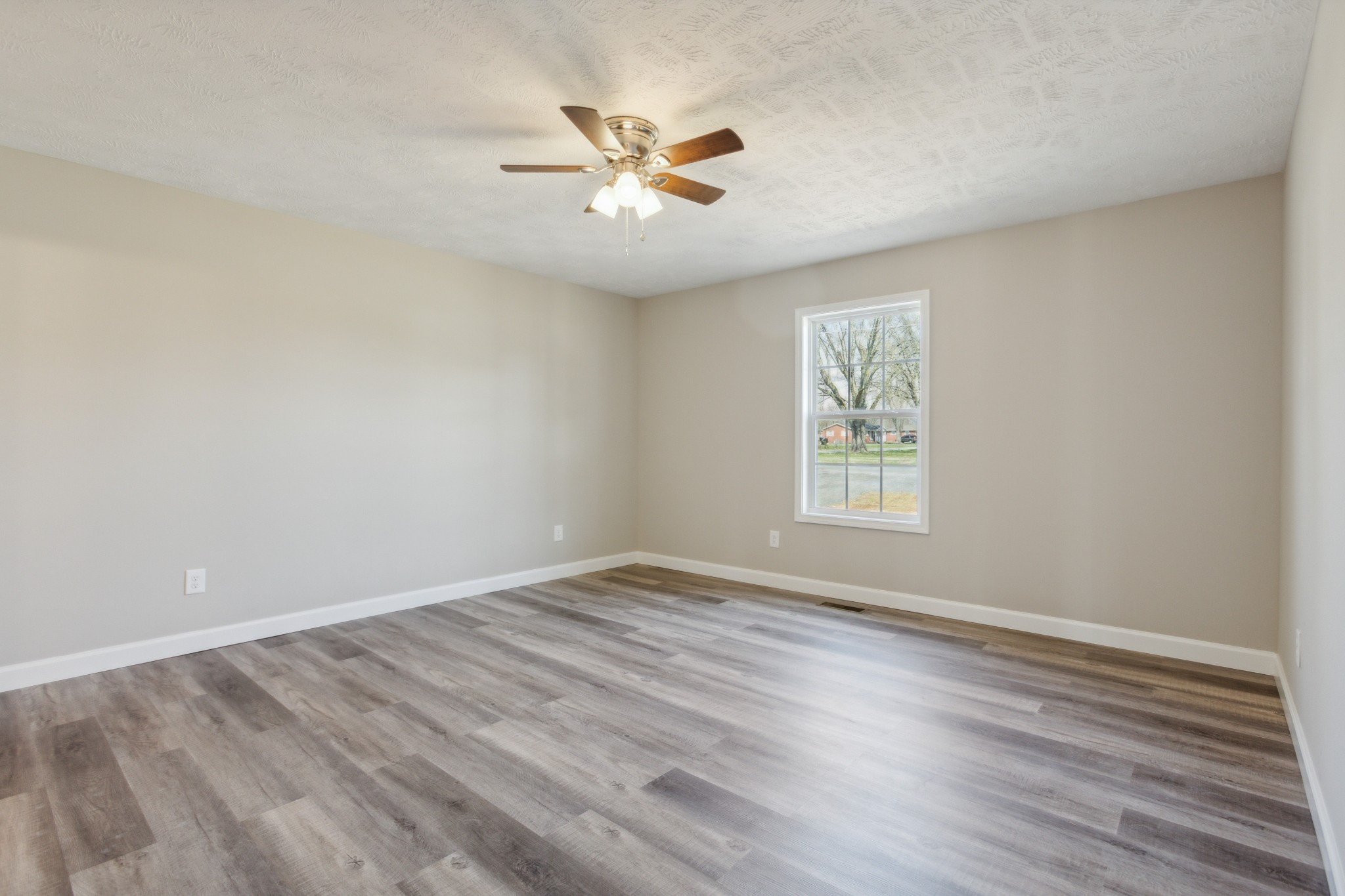 812 Days Road Lafayette, TN 37083 - Photo 13 of 25 wooden floor in an empty room with a window