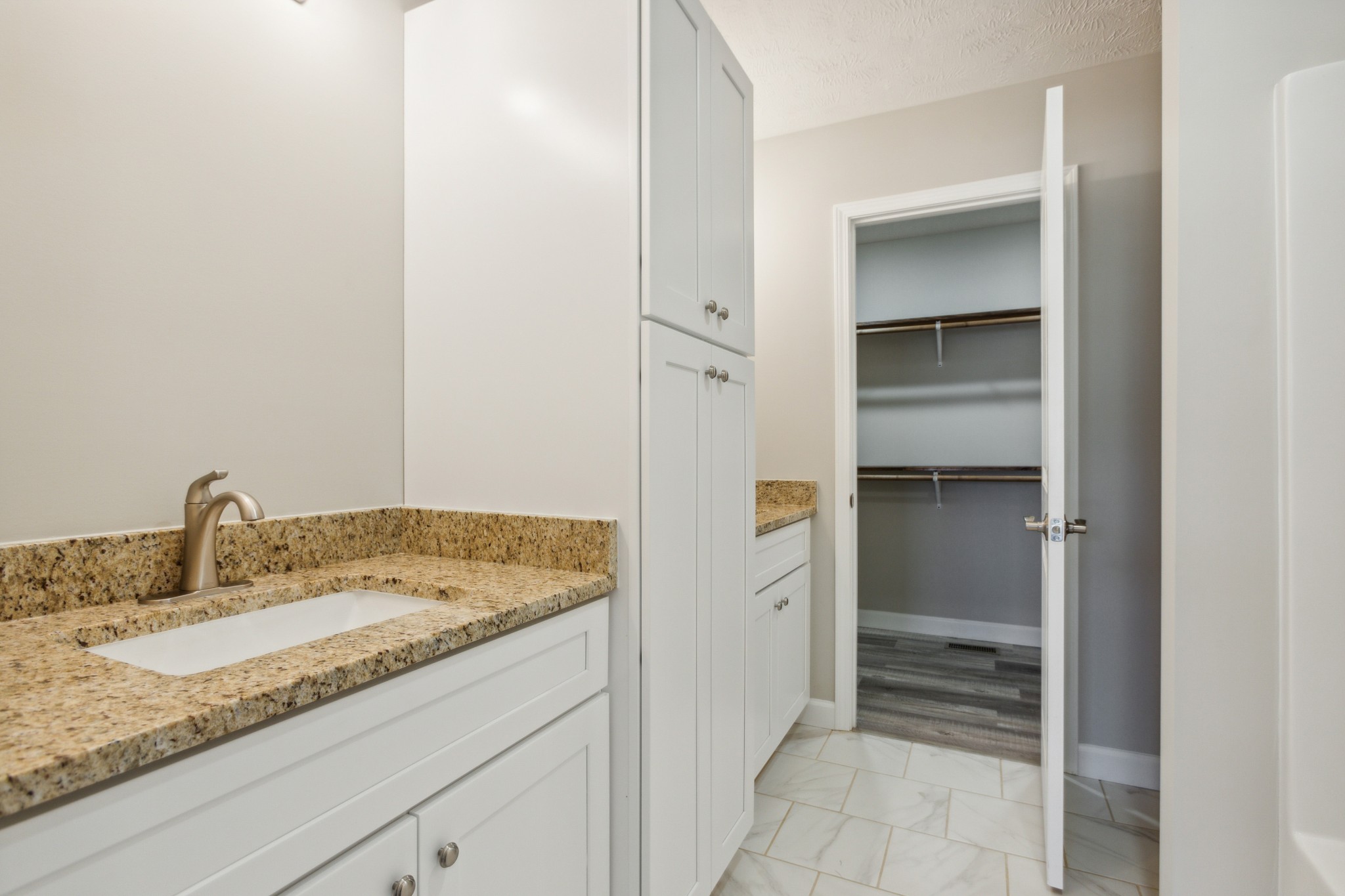 812 Days Road Lafayette, TN 37083 - Photo 15 of 25 a bathroom with a granite countertop sink and washing machine