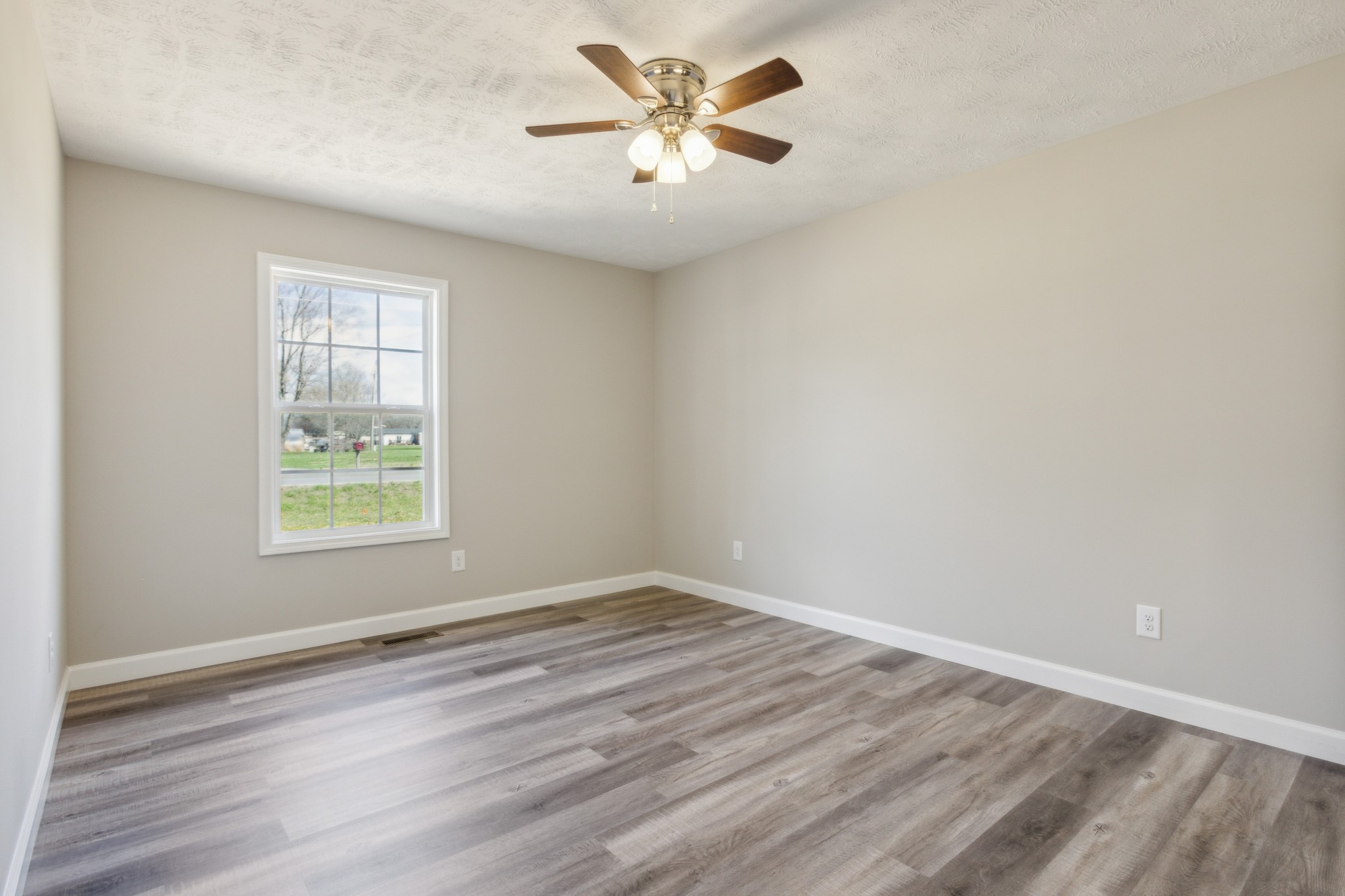 812 Days Road Lafayette, TN 37083 - Photo 17 of 25 wooden floor in an empty room with a window