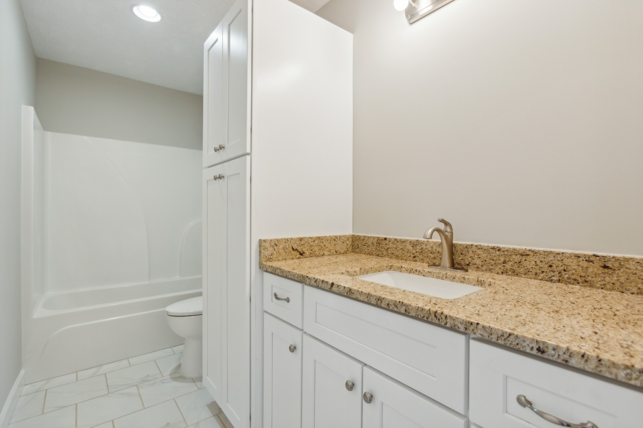 812 Days Road Lafayette, TN 37083 - Photo 19 of 25 a bathroom with a granite countertop sink and toilet