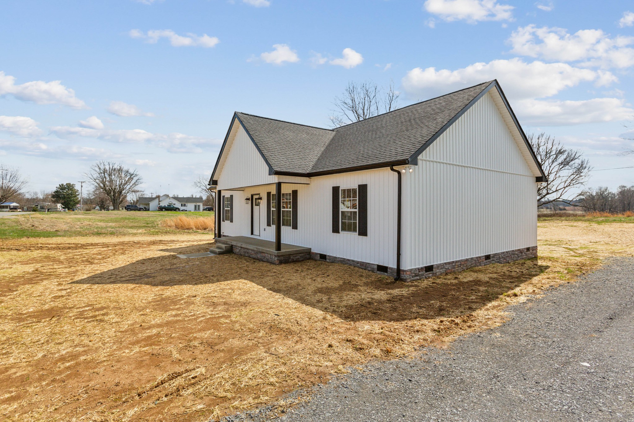 812 Days Road Lafayette, TN 37083 - Photo 2 of 25 a view of a house with backyard and a ocean view