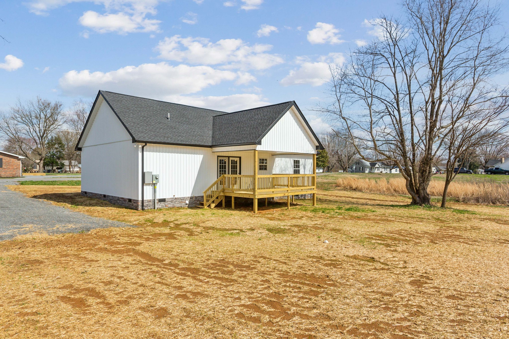 812 Days Road Lafayette, TN 37083 - Photo 24 of 25 a view of a house with a yard covered in snow