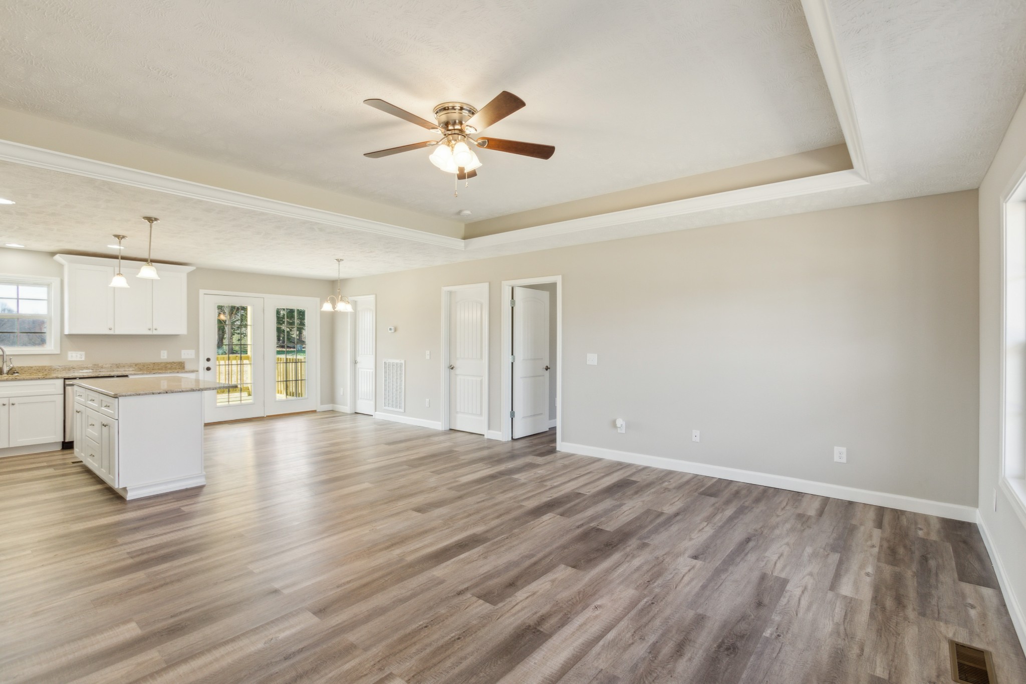 812 Days Road Lafayette, TN 37083 - Photo 4 of 25 a view of an empty room with wooden floor and a window