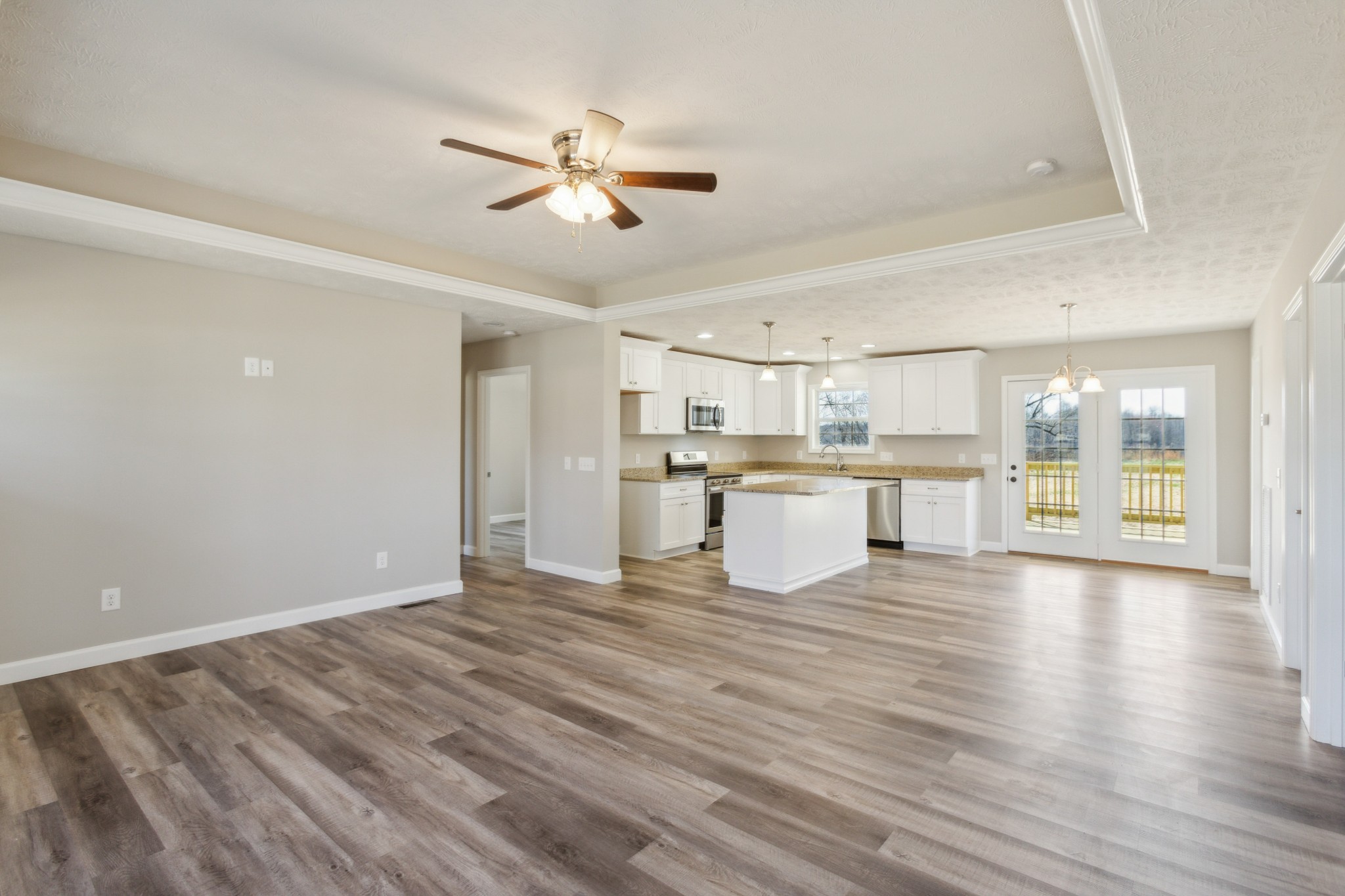 812 Days Road Lafayette, TN 37083 - Photo 5 of 25 a view of kitchen with wooden floor and window