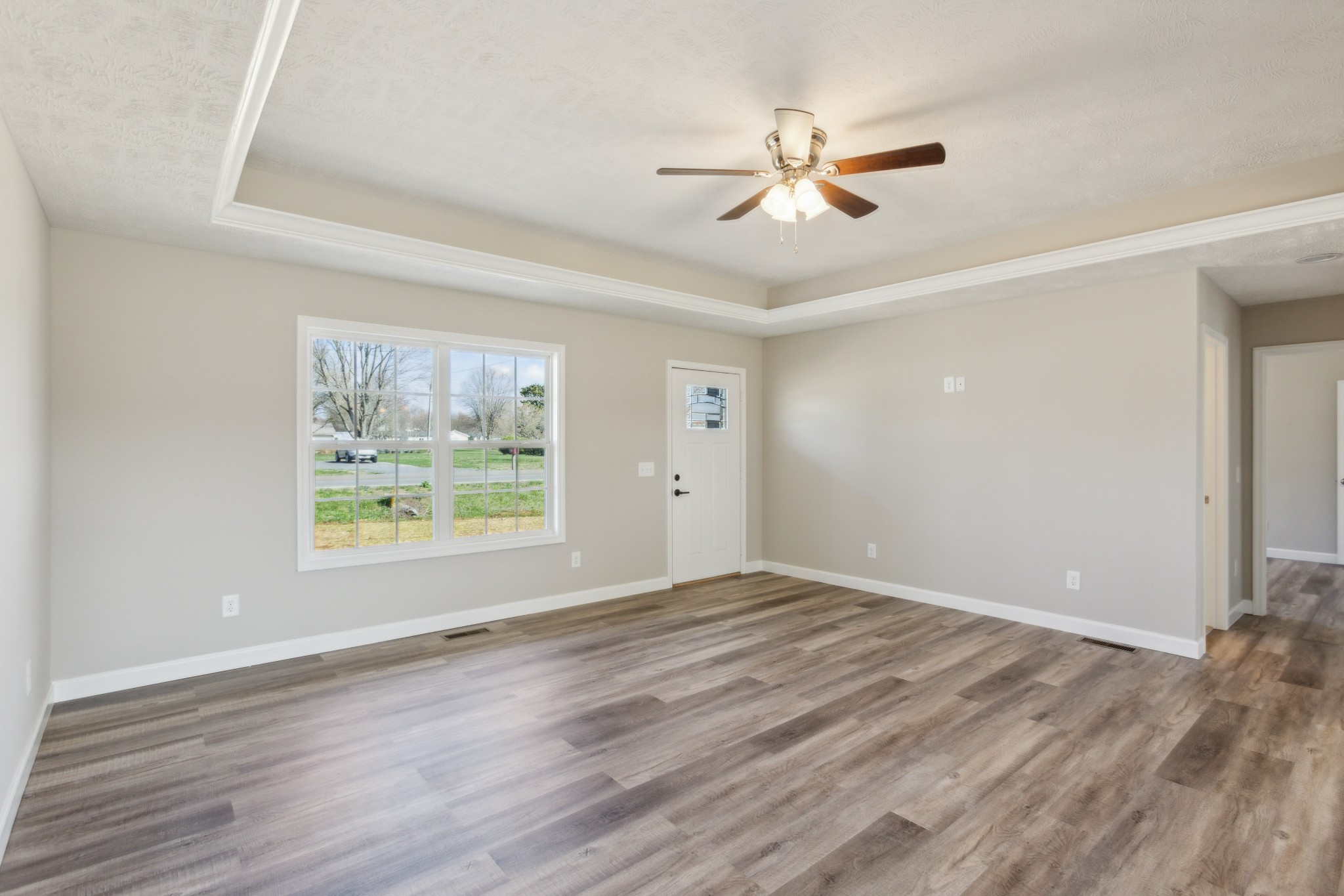 812 Days Road Lafayette, TN 37083 - Photo 6 of 25 a view of an empty room with wooden floor and a window