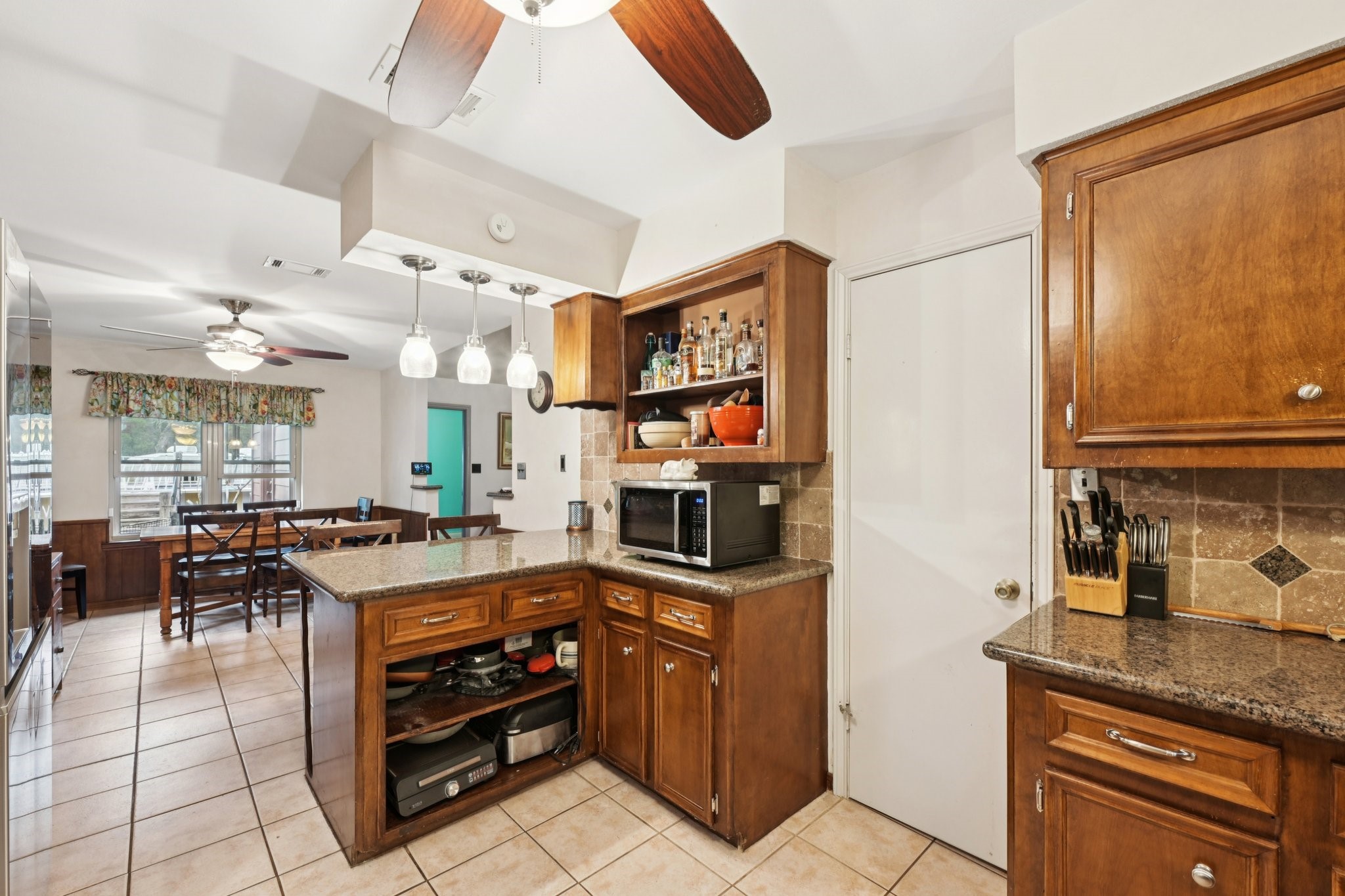 2007 Diane Street Pinehurst, TX 77362 - Photo 15 of 49 a kitchen with stainless steel appliances granite countertop a stove and cabinets
