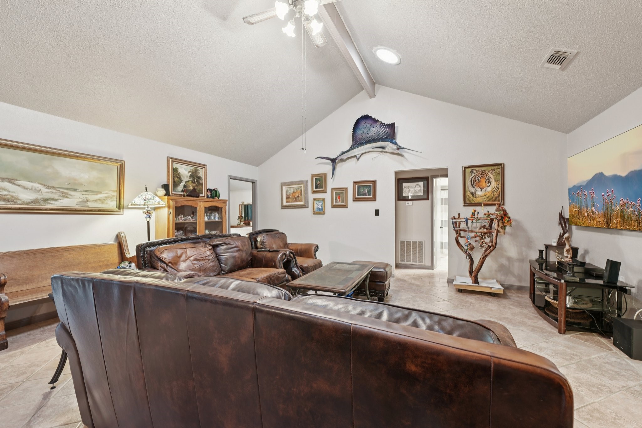 2007 Diane Street Pinehurst, TX 77362 - Photo 27 of 49 a living room with furniture and a flat screen tv