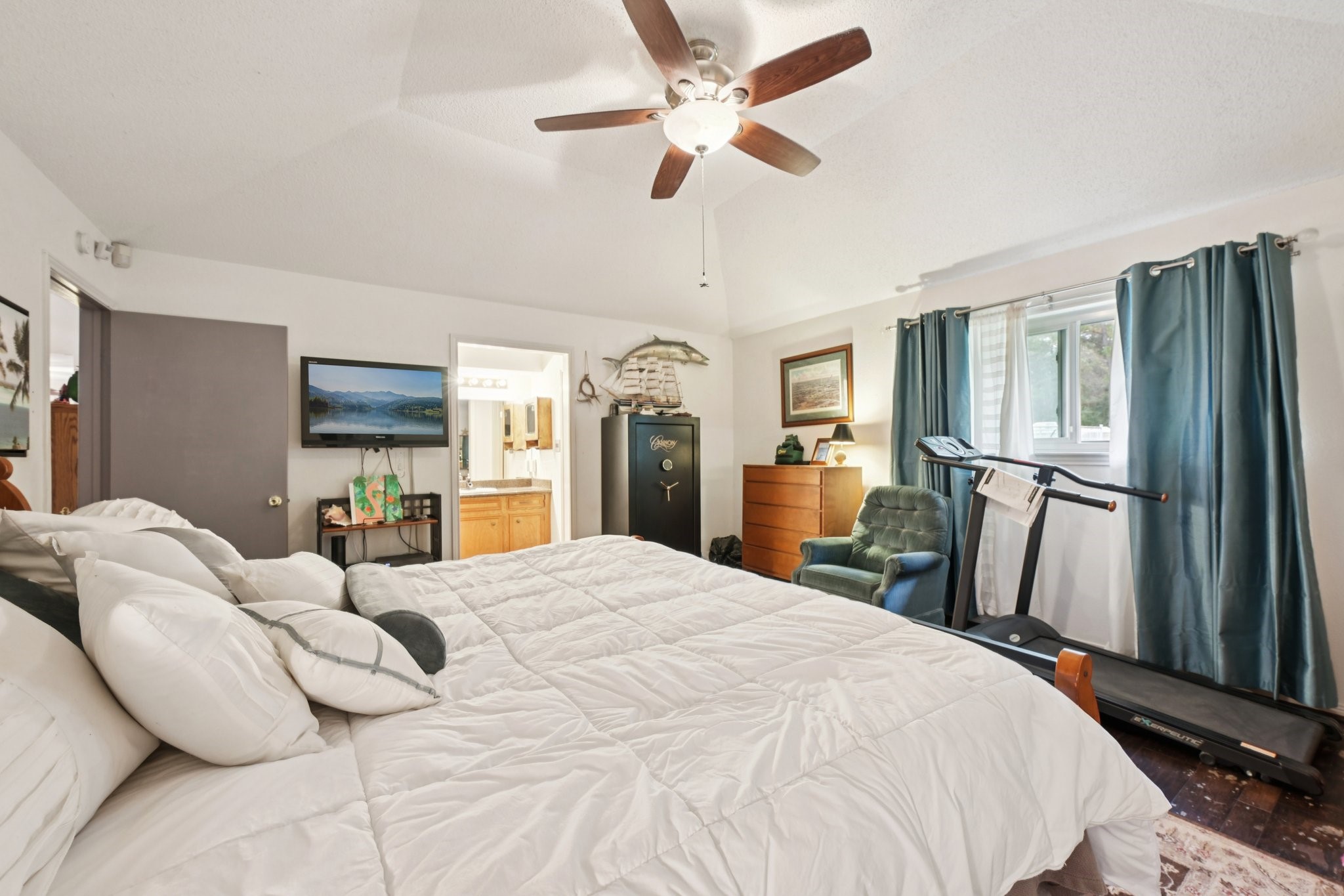 2007 Diane Street Pinehurst, TX 77362 - Photo 28 of 49 a large bedroom with a bed dresser and a large window