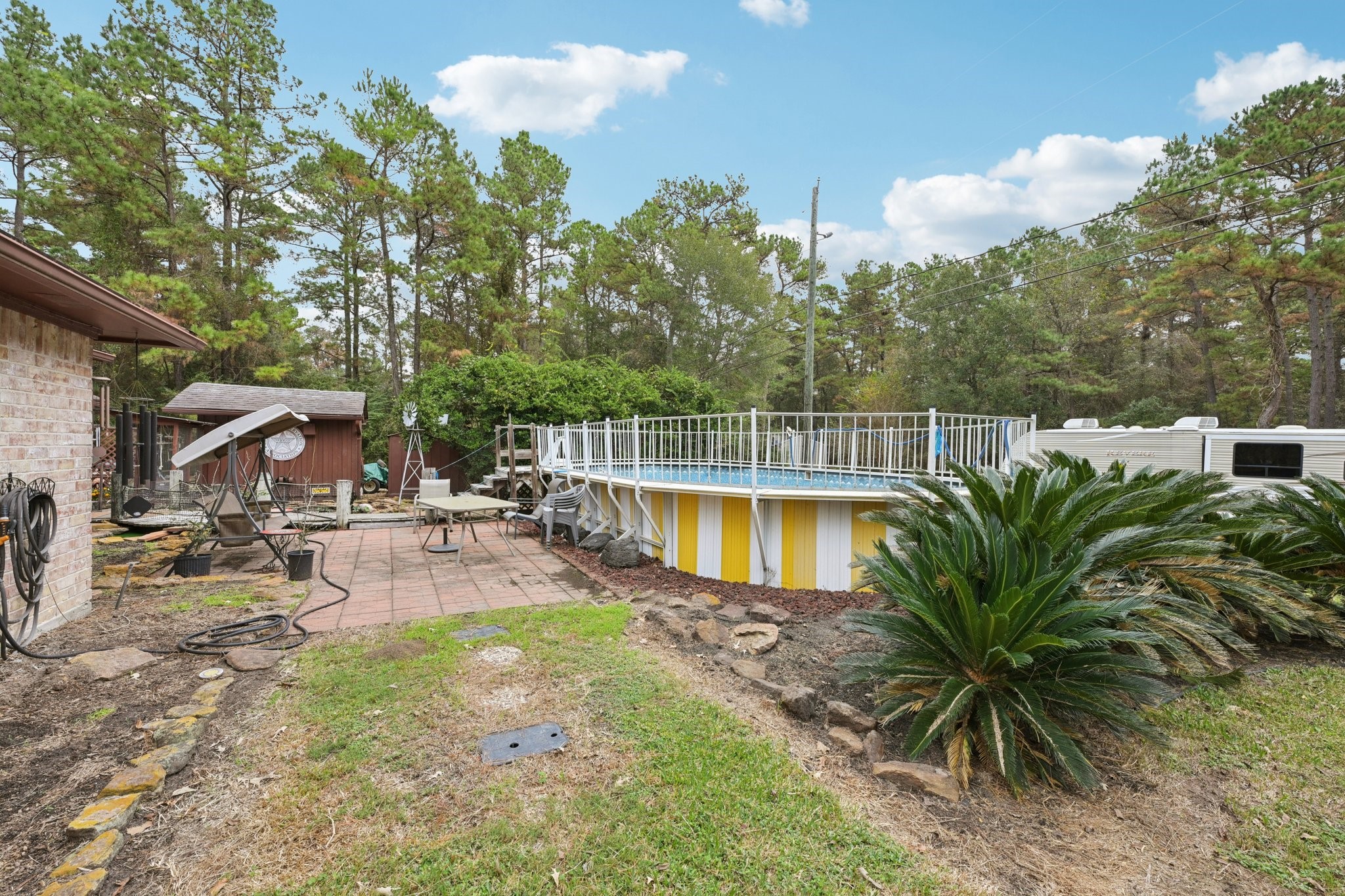 2007 Diane Street Pinehurst, TX 77362 - Photo 37 of 49 a view of a backyard with swimming pool