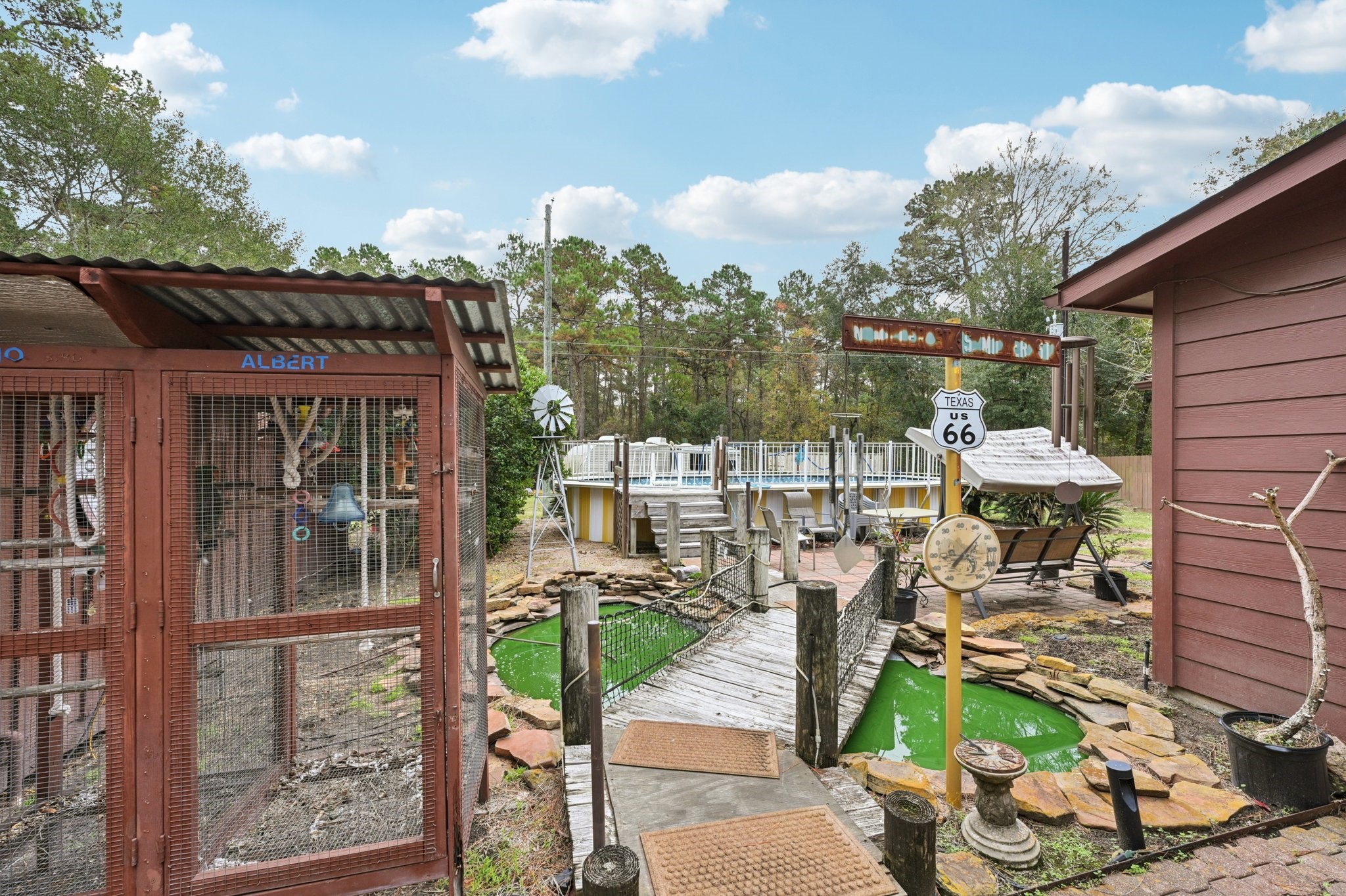 2007 Diane Street Pinehurst, TX 77362 - Photo 38 of 49 a view of a patio with table and chairs potted plants