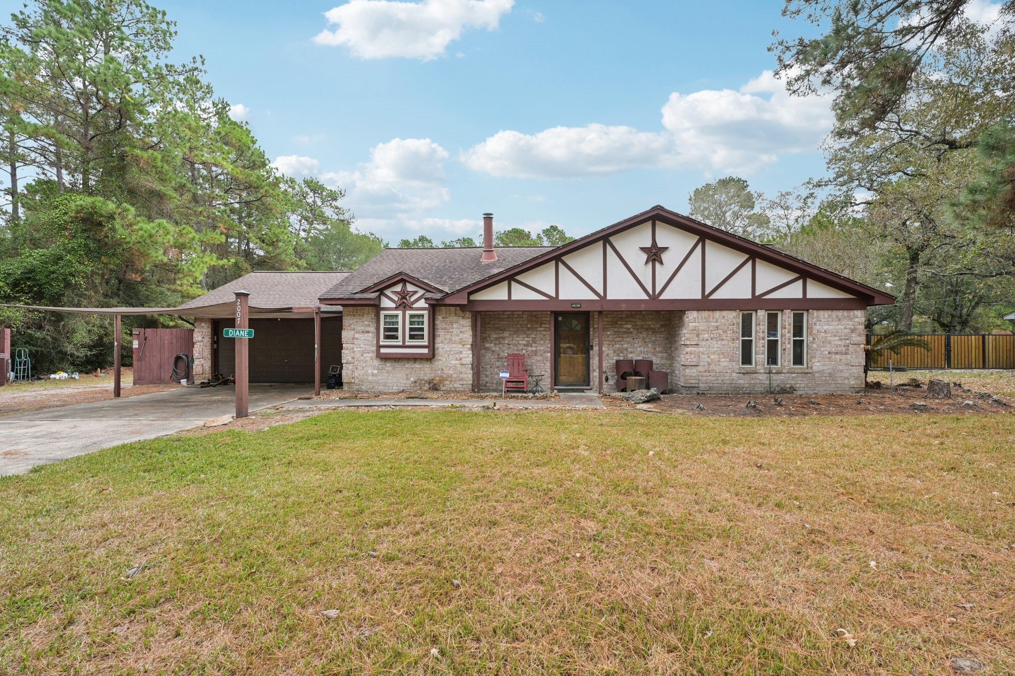 2007 Diane Street Pinehurst, TX 77362 - Photo 4 of 49 a front view of a house with a yard