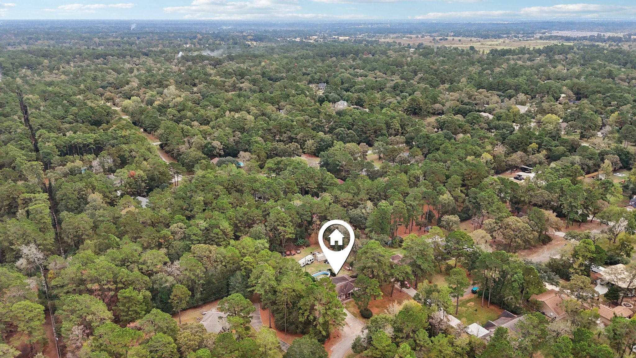 2007 Diane Street Pinehurst, TX 77362 - Photo 43 of 49 a view of a city with lush green forest