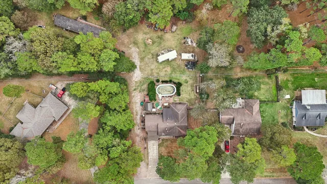 a front view of a house with balcony and garden