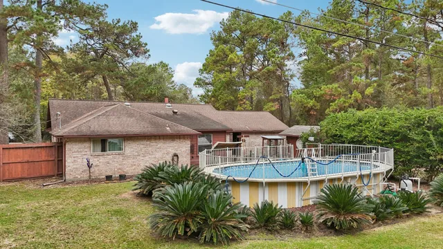 an aerial view of a house with outdoor space