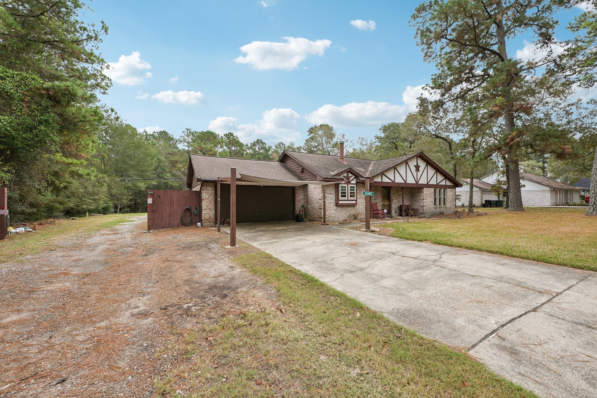 2007 Diane Street Pinehurst, TX 77362 - Photo 7 of 49 a front view of a house with a yard and garage