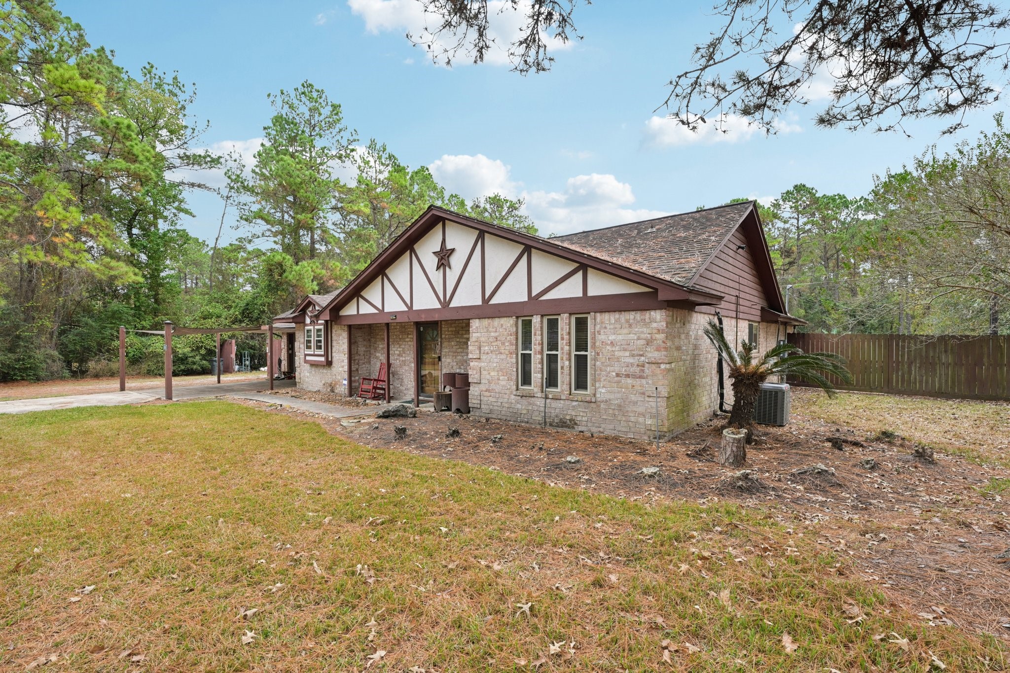 2007 Diane Street Pinehurst, TX 77362 - Photo 8 of 49 a view of a house with a yard