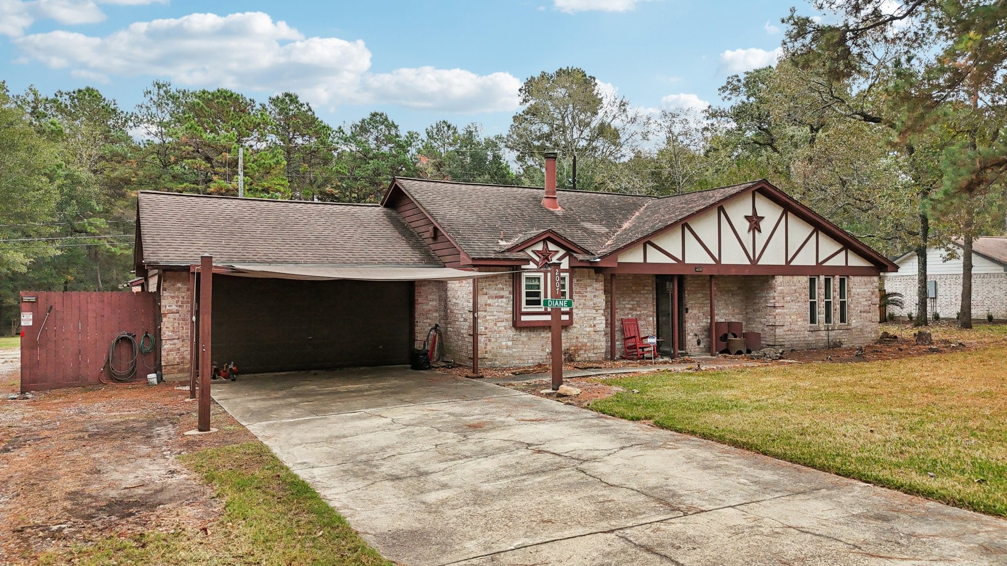2007 Diane Street Pinehurst, TX 77362 - Photo 10 of 49 a view of a house with a yard and large tree