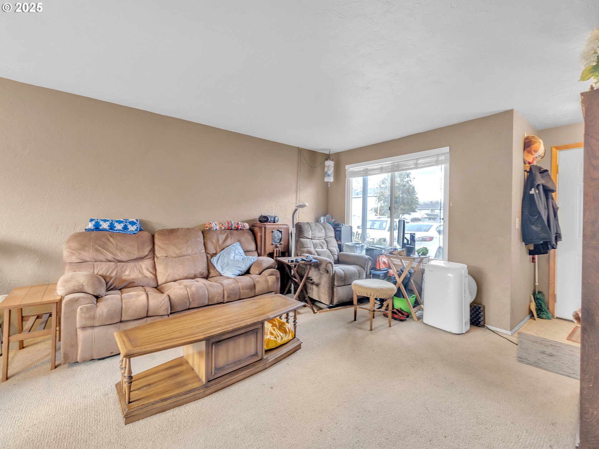 2551 Southwest Pickford Street, Unit D Corvallis, OR 97333 - Photo 14 of 25 a living room with furniture and a window