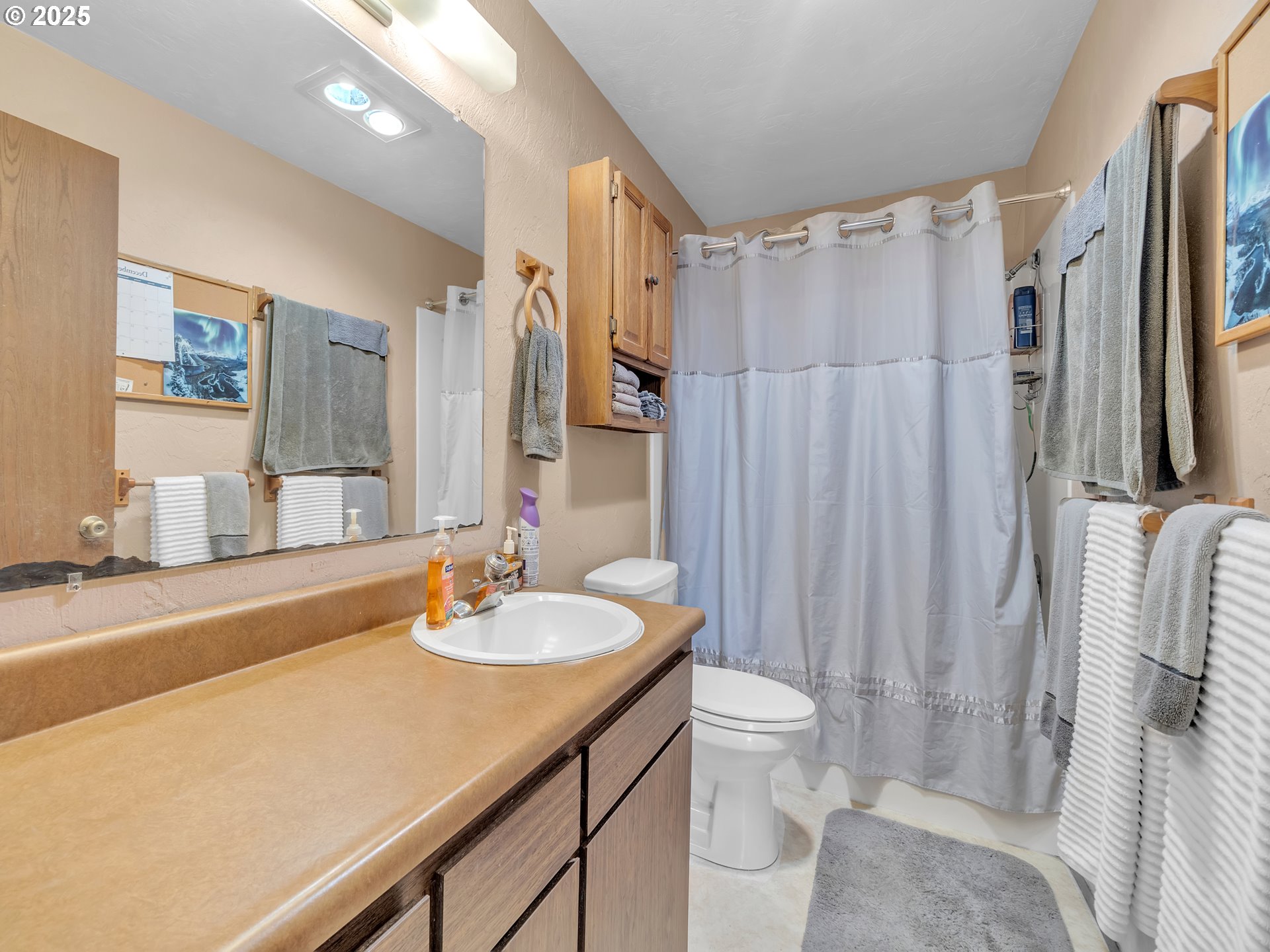 2551 Southwest Pickford Street, Unit D Corvallis, OR 97333 - Photo 17 of 25 a bathroom with a sink toilet and shower