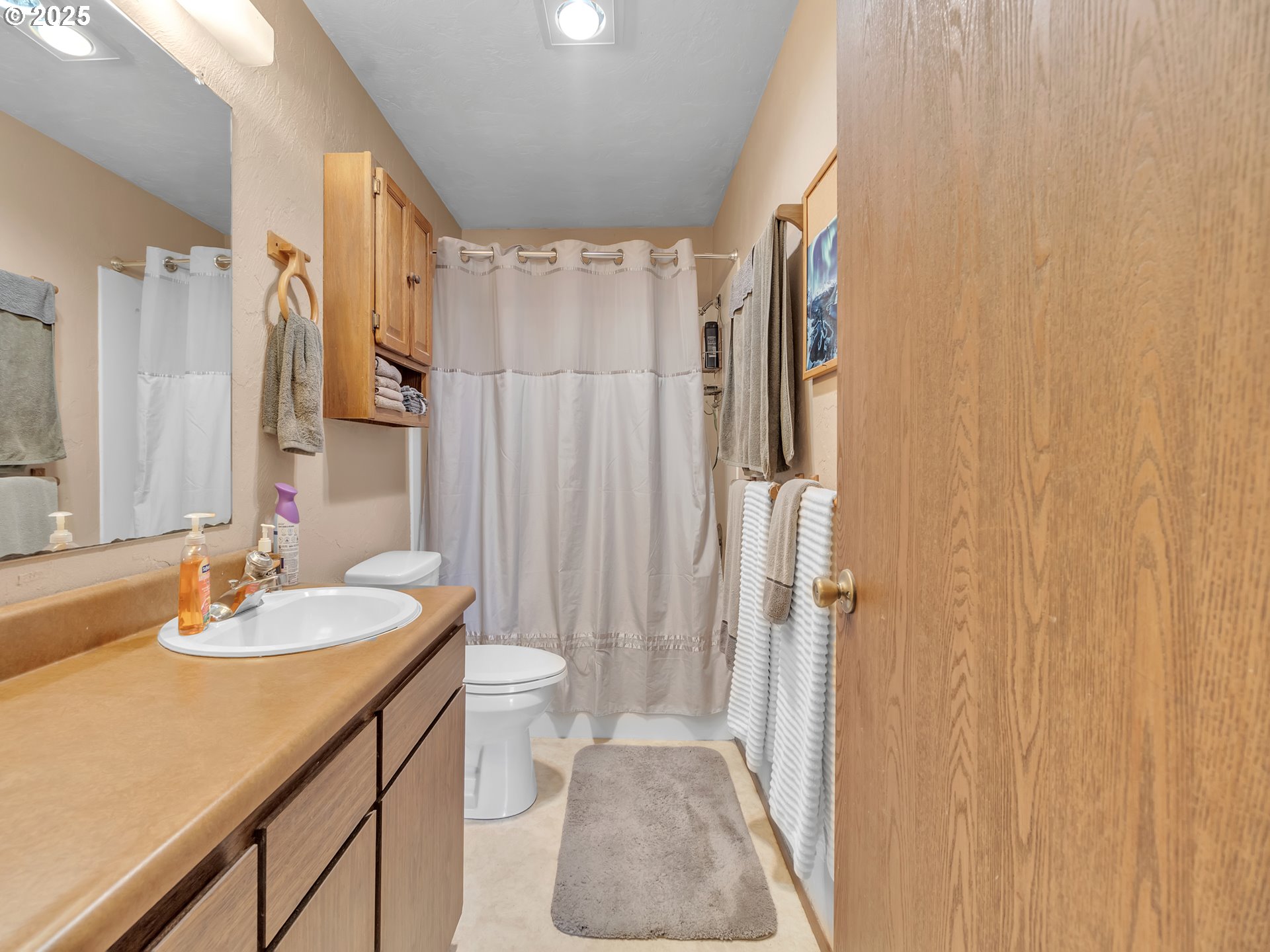 2551 Southwest Pickford Street, Unit D Corvallis, OR 97333 - Photo 18 of 25 a bathroom with a sink toilet and shower