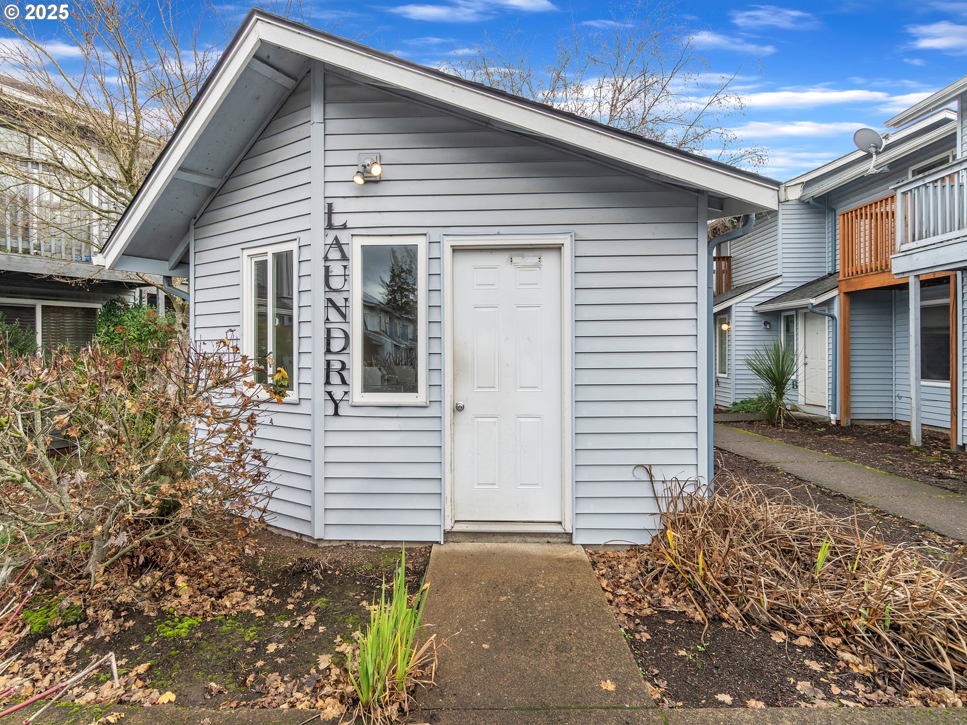 2551 Southwest Pickford Street, Unit D Corvallis, OR 97333 - Photo 19 of 25 a front view of a house with a garden